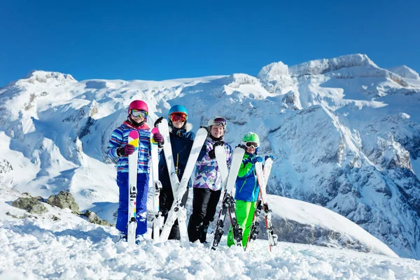 Ski School Group Concept Four Happy Children Stand Holding Equipment — Stock Photo, Image