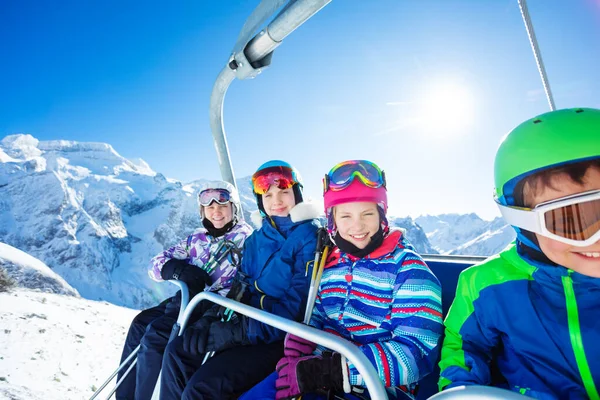 Group Four Happy Smiling Kids Sit Chairlift Together Magnificent Beautiful — Stock Photo, Image