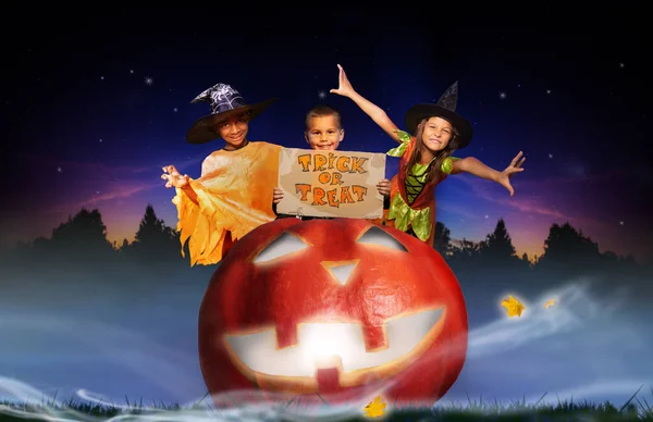 Group Three Children Costumes Trick Tread Sign Huge Halloween Scary Royalty Free Stock Images