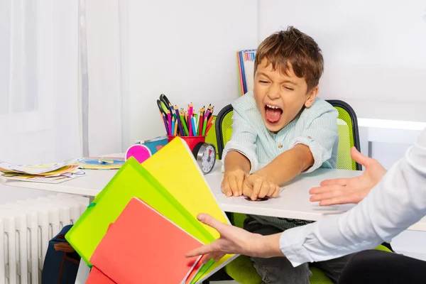 Boy Autism Spectrum Disorder Throw Textbooks Books Table Negative Expression — Stock Photo, Image