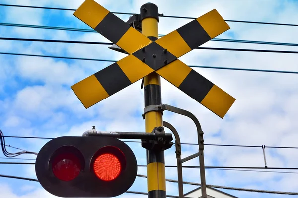 Scene of the warning signal of the railroad crossing of the town of the day of the blue sky which it was fine
