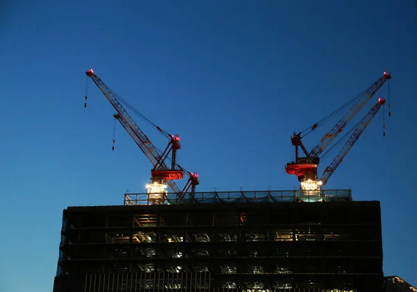 Night sky and night view of crane work on construction site