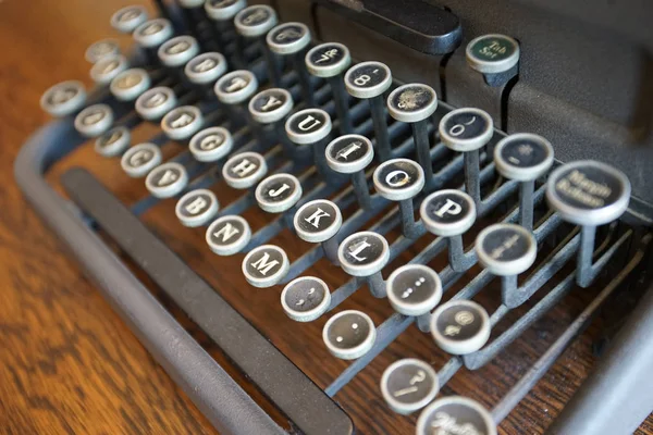 Scene of the key to old typewriter on the desk of the room