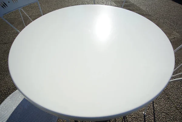 Scenery of white circle table and chair in garden with copy space