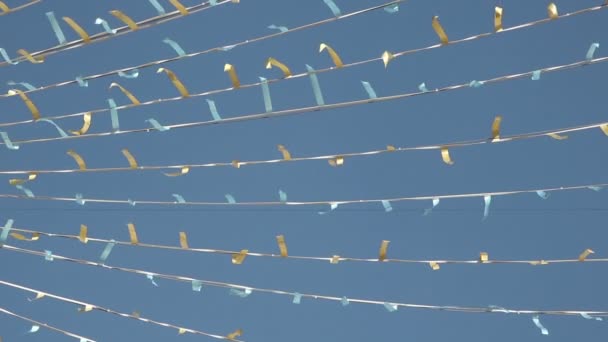 Light Blue Golden Colored Stripes Hanging Ropes — Stock Video