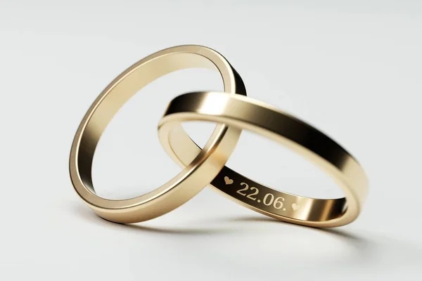 Anneaux de mariage isolés en or avec date 22. Juin — Photo