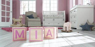 Çocuk odasında ahşap oyuncak küpleriyle yazılı adı mia