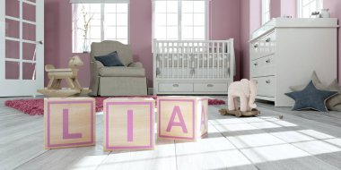 Çocuk odasında ahşap oyuncak küpleriyle yazılı adı lia