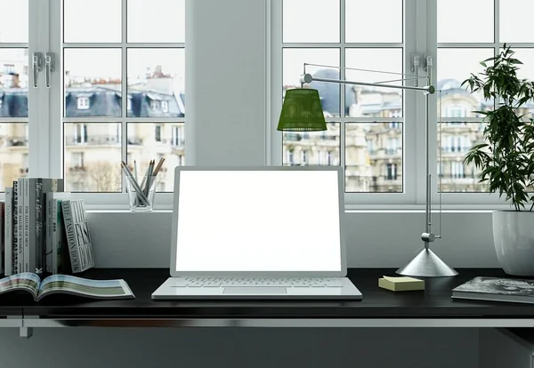 Макет ноутбука с белым экраном стоит на столе офиса — стоковое фото