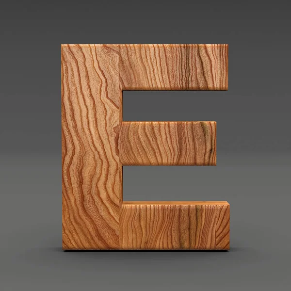 Деревянная буква Е изолированы на темном фоне — стоковое фото