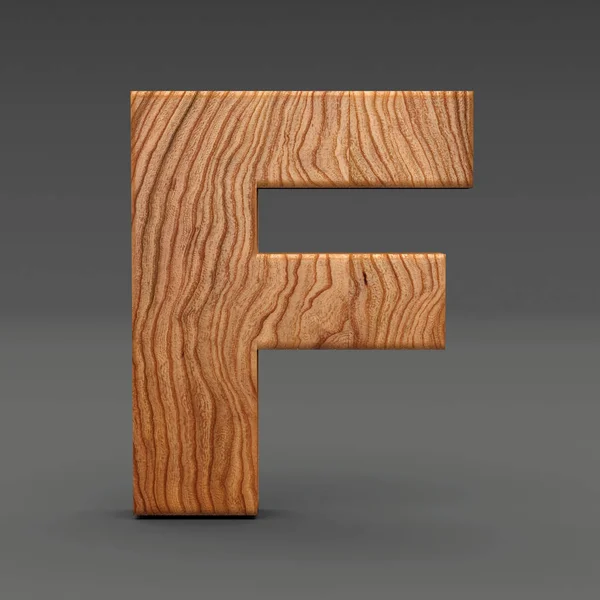 Wooden letter F isolated on dark background — Stock Photo, Image
