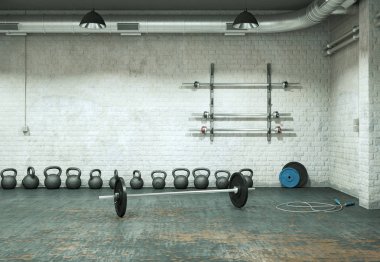 Bir spor salonu zemin üzerinde siyah plakalı halter