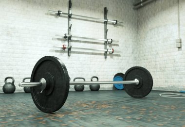 Bir spor salonu zemin üzerinde siyah plakalı halter