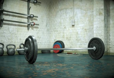 Bir spor salonu zemin üzerinde siyah plakalı halter