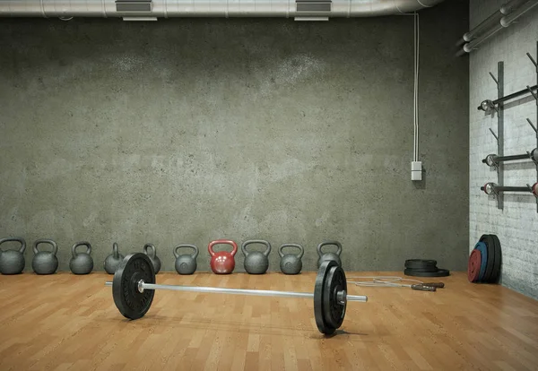 Barbell con placas negras en un piso de gimnasio —  Fotos de Stock