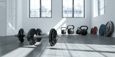 Bir spor salonu zemin üzerinde siyah plakalı halter