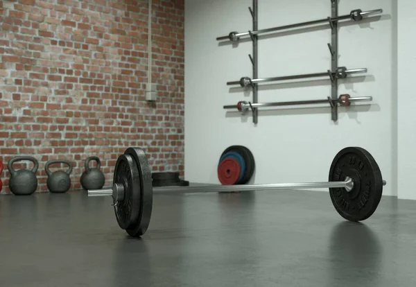 Barbell con placas negras en un piso de gimnasio — Foto de Stock