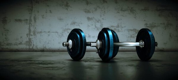 Dumbbell with black plates on a gym floor