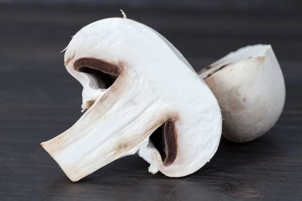 cut into pieces and half white mushrooms, while preparing the dish