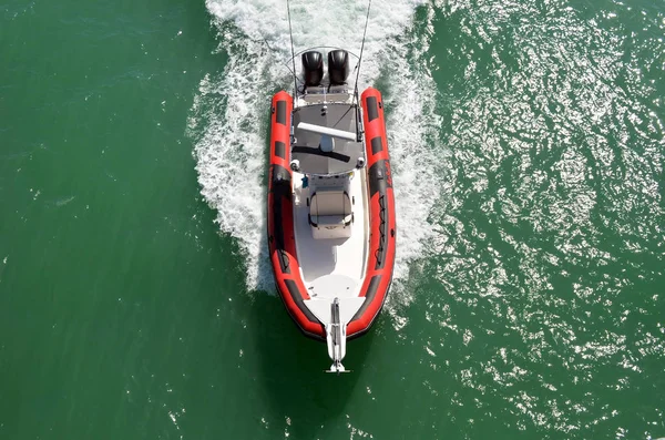 Overhead view of a motor boat powered by two outboard engines speeding on the Florida intra-coastal Waterway eff Miami Beach.