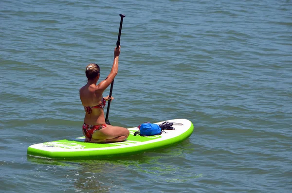 Slender Young Woman Paddling Paddle Board Kneeling Position — Stock Photo, Image