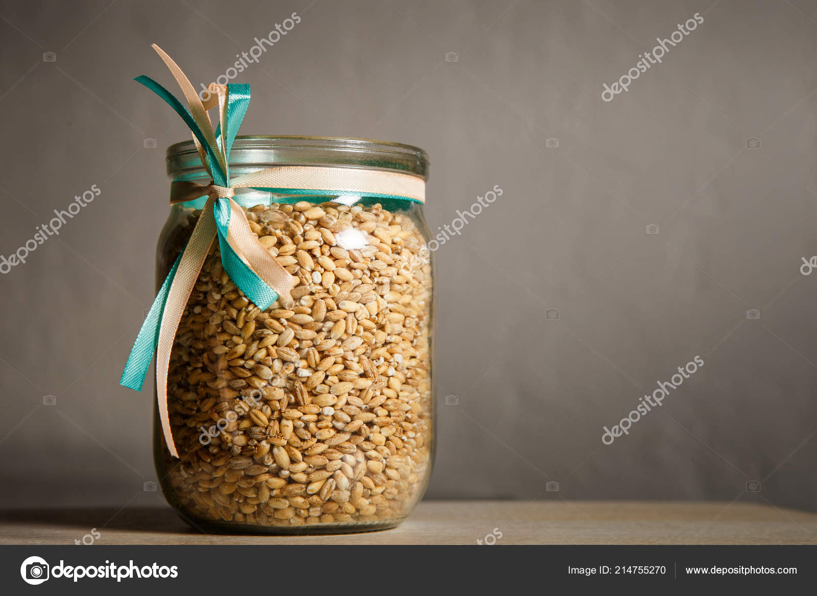 Opened Glass Jar Decorated White Blue Ribbons Filled Wheat Seeds