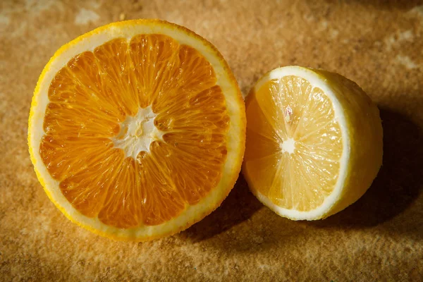 ripe juicy lemon cut in half lies on kitchen table