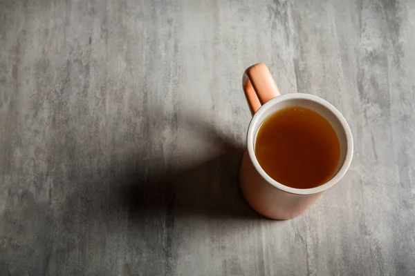 Top View Peach Colored Cup Tea Which Stands Gray Background — Stock Photo, Image