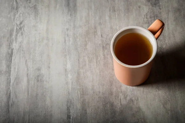 Top View Peach Colored Cup Tea Which Stands Gray Background — Stock Photo, Image