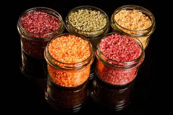 Felülnézet kis üveg kancsó tele különböző színű tengeri só — Stock Fotó