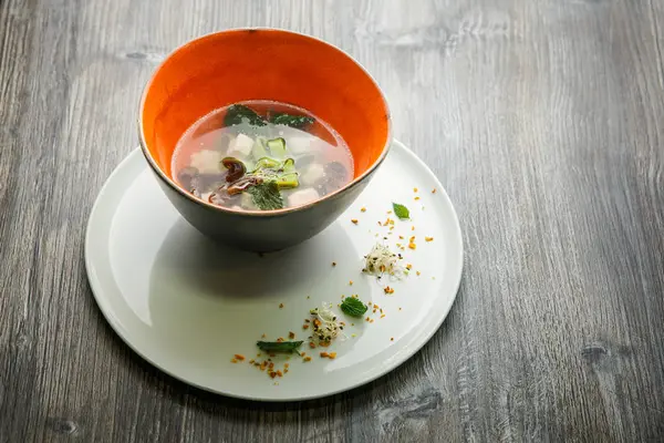 Traditional noodle soup with mushrooms, meat, and nettle leaves — Stock Image Traditional noodle soup with mushrooms, meat, and nettle leaves Royalty Free Stock Images