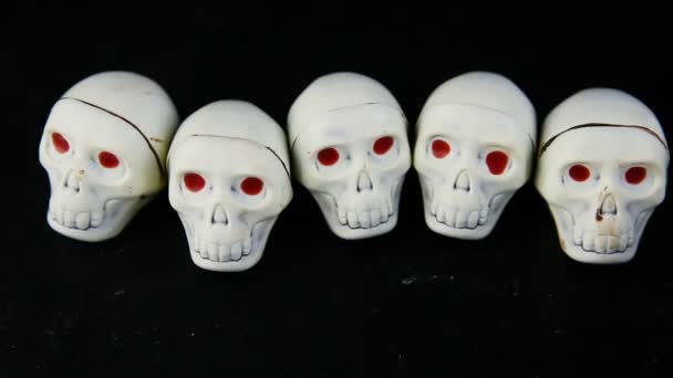 Human Hand Put Six White Chocolate Candies Skeleton Skull Shape — Stock Video