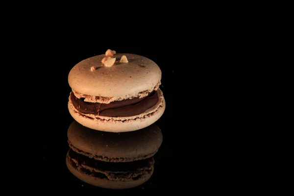 Closeup beige peanut macaron with chocolate filling — Stock Photo, Image