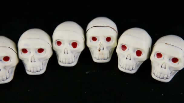 Panorama View Row White Chocolate Candies Skeleton Skull Shape Red — Stock Video