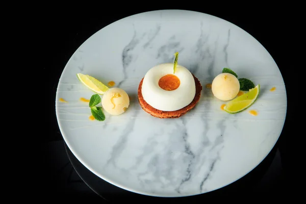 stock image top view on white mini mousse cake with ice cream and limes