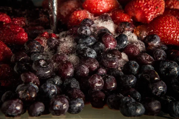 frozen thawed blueberries and strawberries on plate
