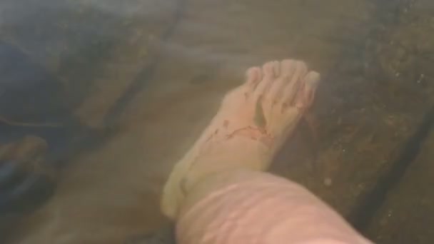 Macro Man Puts Foot Transparent Cold River Big Stone Water — Stock Video