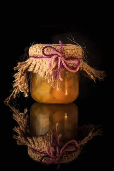 Vertical view of small glass jar of homemade yellow fruit jam — Stock Photo, Image