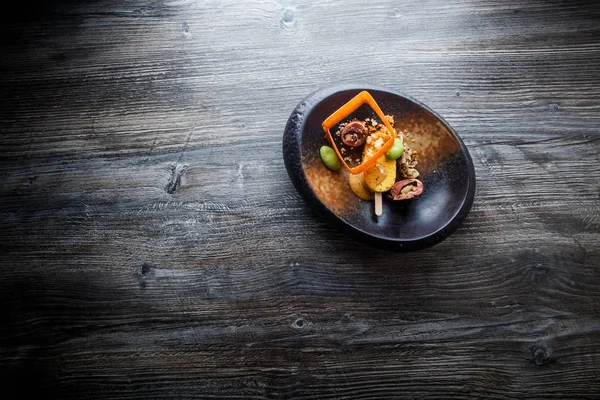 Top view on exclusive fish dish with beautiful garnish — Stock Photo, Image