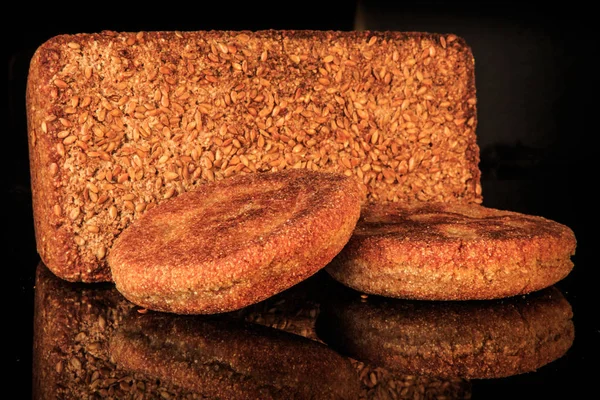 closeup rectangular ray bread with and two roasted flapjacks