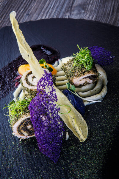 closeup luxury decorated fish rolls stuffed with herbs