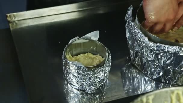 Slow motion closeup woman hands tamp part of soft yeast dough into baking form — Stock Video