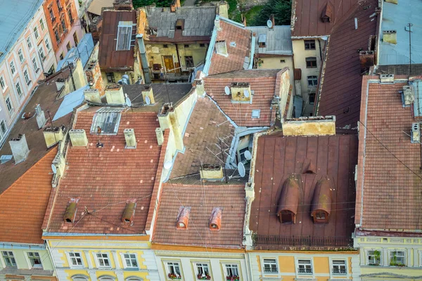 top view from town hall tower on old houses rooftops and inner yards in historical center of Lviv city, Ukraine