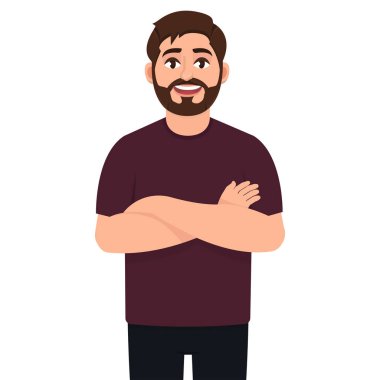 Yakışıklı bir genç adam kollarını kavuşturup gülümsüyor.