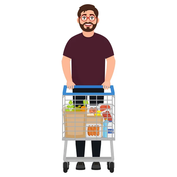 Ein bärtiger Mann steht mit einem Einkaufswagen, der Einkaufswagen ist mit grauen Produkten gefüllt, kauft im Supermarkt ein, eine Figur im Cartoon-Stil — Stockvektor