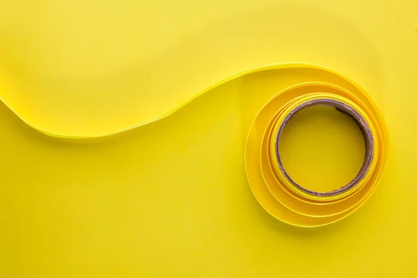 Yellow  ribbon on yellow background