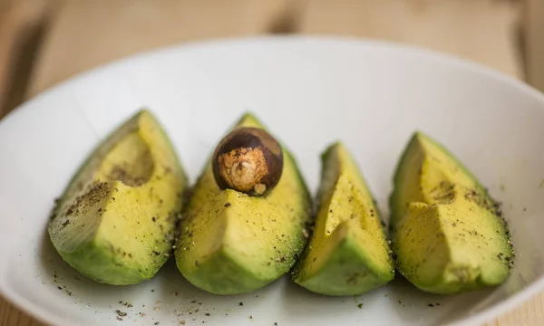 the avocado on the plate - a great source of healthy fat, makes you fit