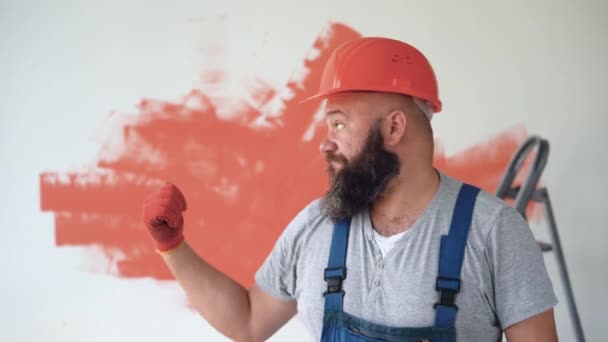 Builder Uniform Orange Protective Helmet Bearded Man She Looks Camera — Stock Video