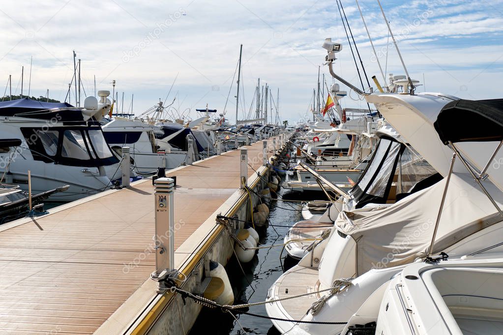 Moored boats in the port of Santa Eulalia. Santa Eulalia is a beautiful town and resort on the East coast of the Ibiza island. Balearic Islands, Spain