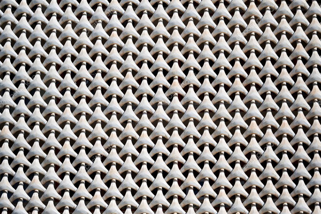 Concrete grate on the house facade. Full frame, white color